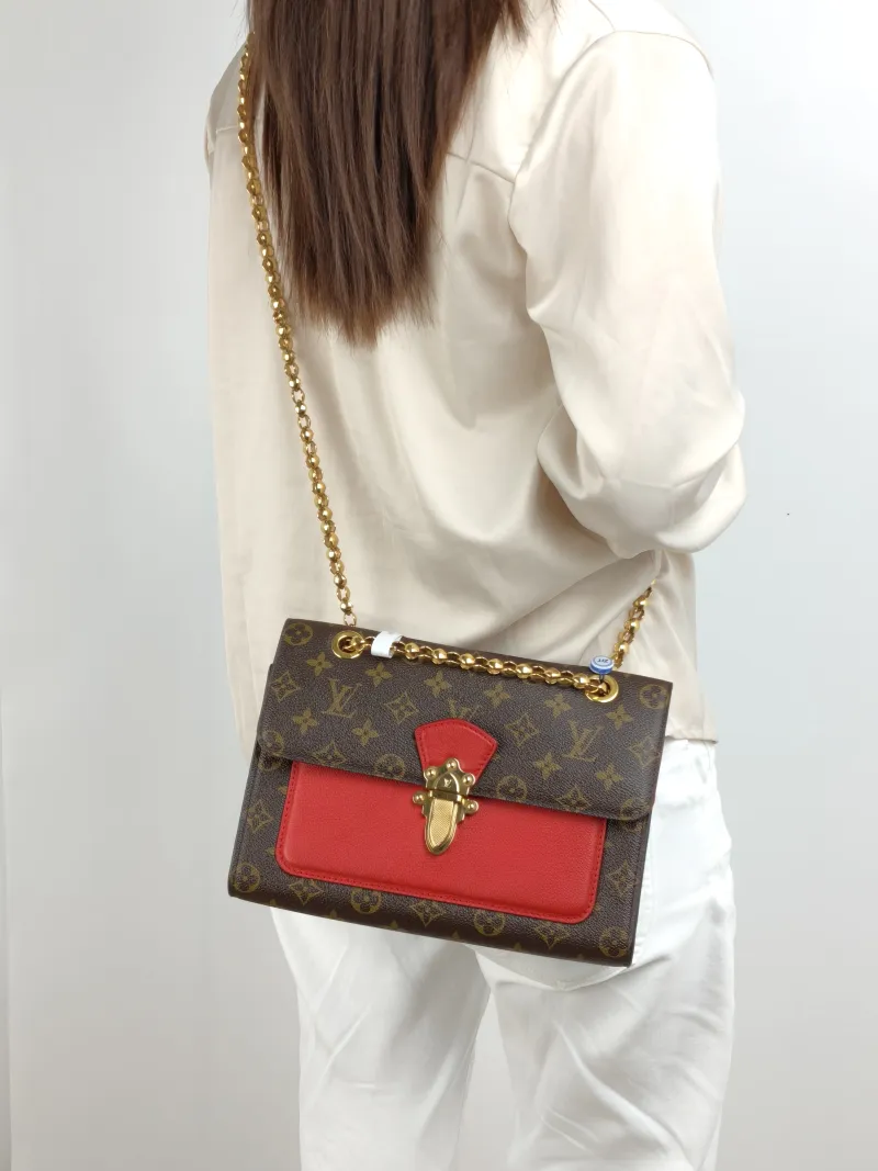 Louis Vuitton Crossbody Bag VICTOIRE Red PVC · Calfskin One Size 27 × 10 × 17 cm — on-model view 2 of 2