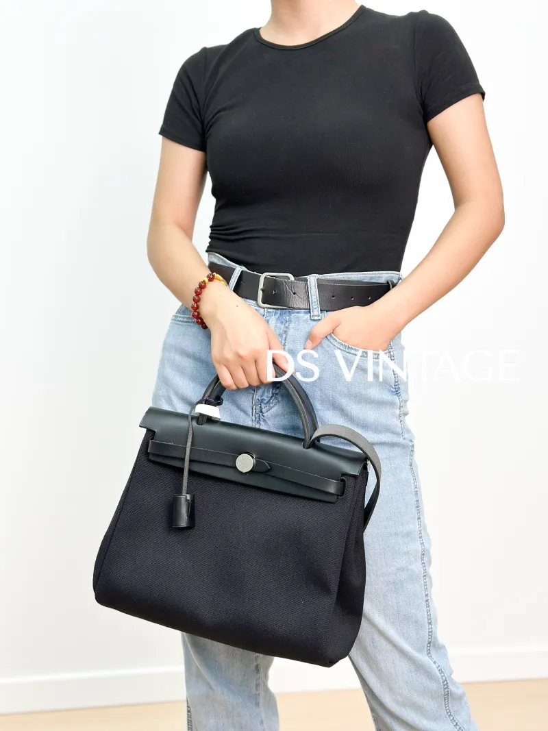 Hermès Shoulder Bag Herbag 31Black Canvas Canvas Berliner Medium31 × 10 × 25 cm — on-model view 1 of 4