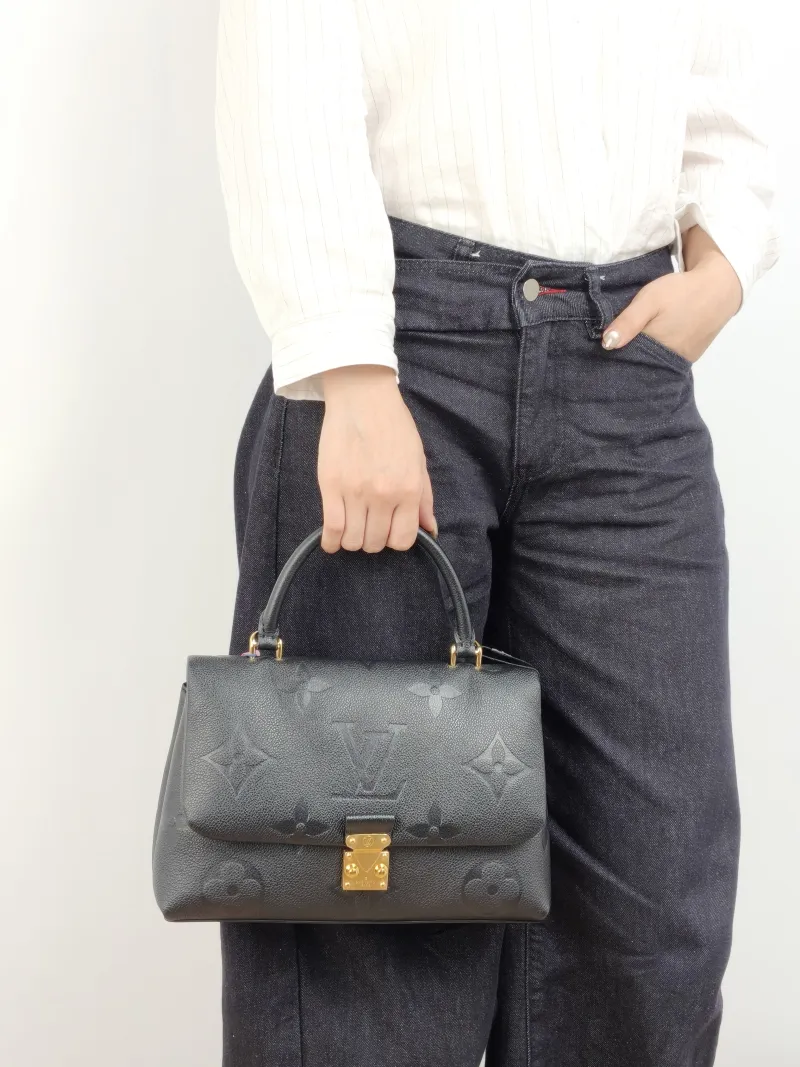 Louis Vuitton Crossbody Bag MADELEINE Black Monogram Empreinte Embossed Calfskin Medium 30 × 11 × 19.5 cm — on-model view 3 of 3