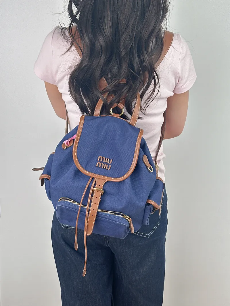 Miumiu Backpack Backpack Blue Canvas Large 25 × 12.5 × 29.5 cm — on-model view 2 of 2