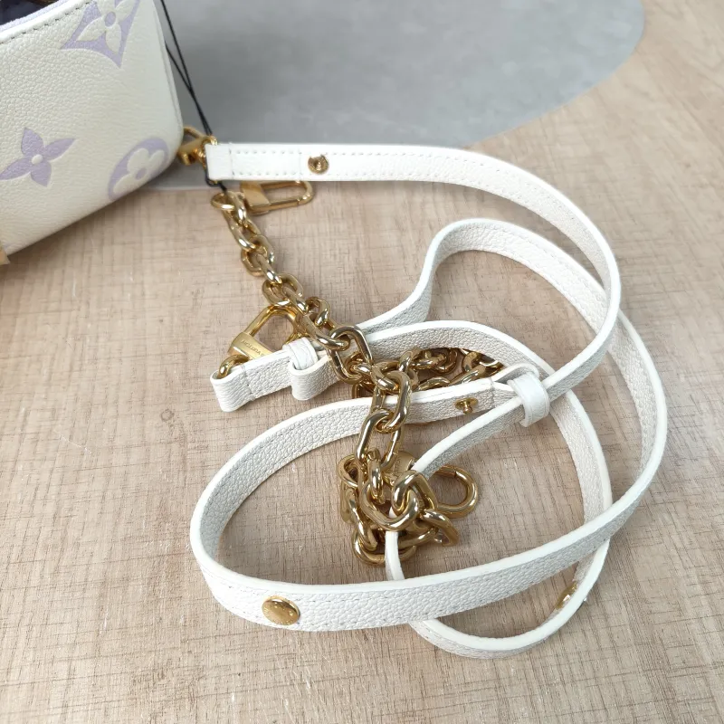 Louis Vuitton Crossbody Bag Pochette Métis East West White · Monogram Empreinte Embossed Calfskin Small 21.5 × 6 × 13.5 cm — detail view 12 of 14