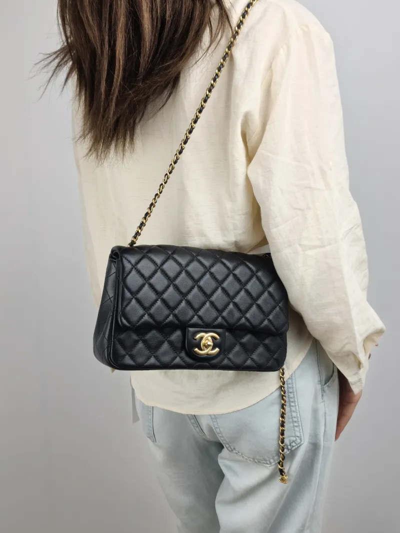 Chanel Shoulder Bag c cf Black Lambskin One Size 24 × 7 × 14.5 cm — on-model view 1 of 2