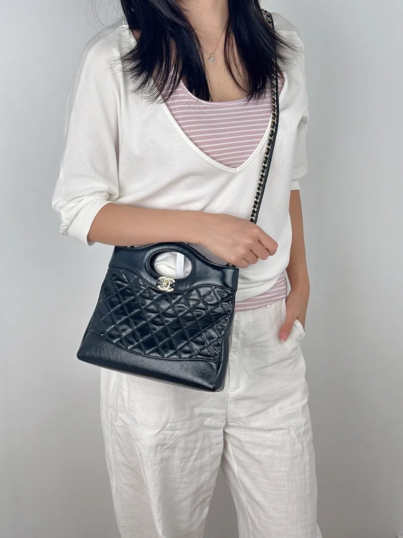 Chanel Crossbody Bag31Bag Black Waxed Leathermini23 × 5.5 × 22 cm — on-model view 3 of 3