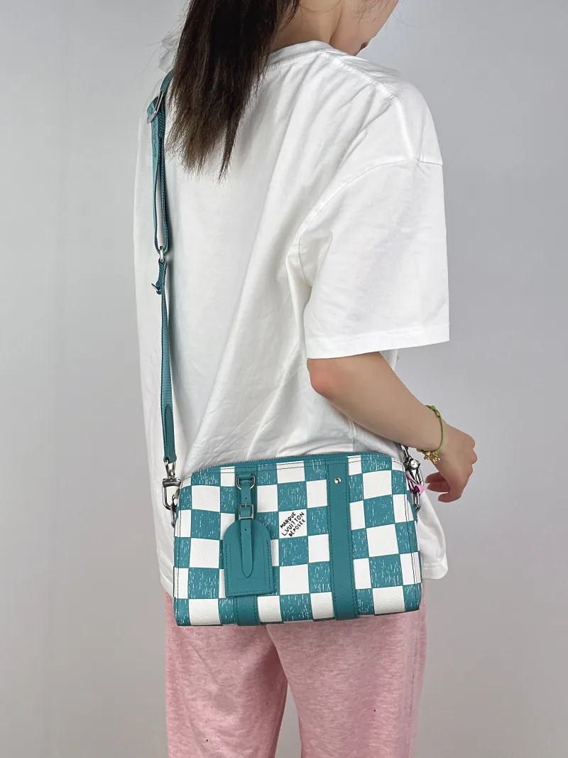Louis Vuitton Crossbody Bag City Keepall Green · White Calfskin Medium27 × 13 × 17 cm — on-model view 1 of 2
