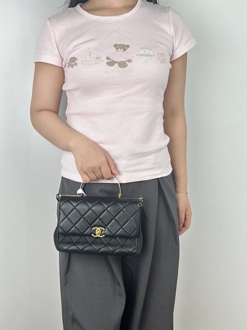 Chanel Crossbody Bag24c mini Black Lambskin One Size20.5 × 6 × 14 cm — on-model view 2 of 3