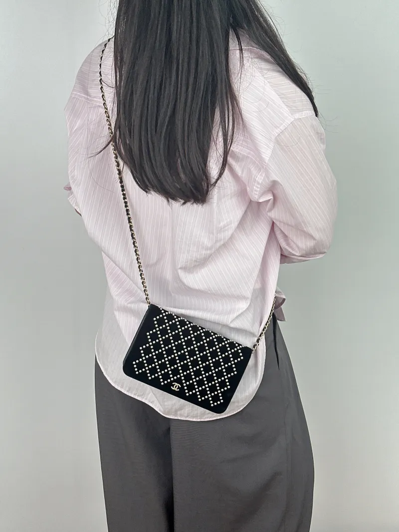 Chanel Crossbody Bag CF Pearl WOC Black Mini 19.2 × 3.5 × 12.3 cm 24 — on-model view 1 of 2