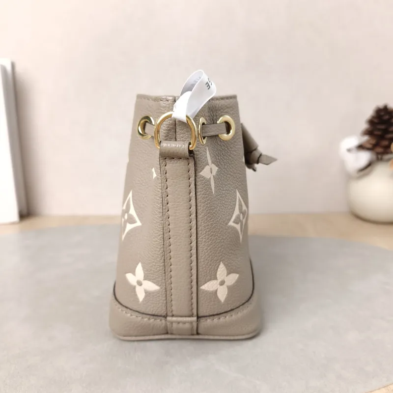 Louis Vuitton Crossbody Bag NANO NOÉ Bucket Bag Nano · White Empreinte Embossed Calfskin Monogramnano13 × 10 × 16 cm — detail view 11 of 15