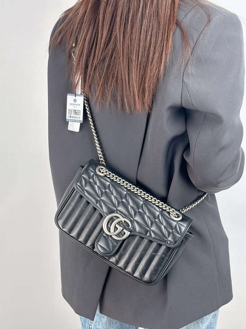 GUCCI Crossbody Bag GG Marmont Medium Marmont 26 Calfskin One Size 26 × 7 × 15 cm — on-model view 1 of 2