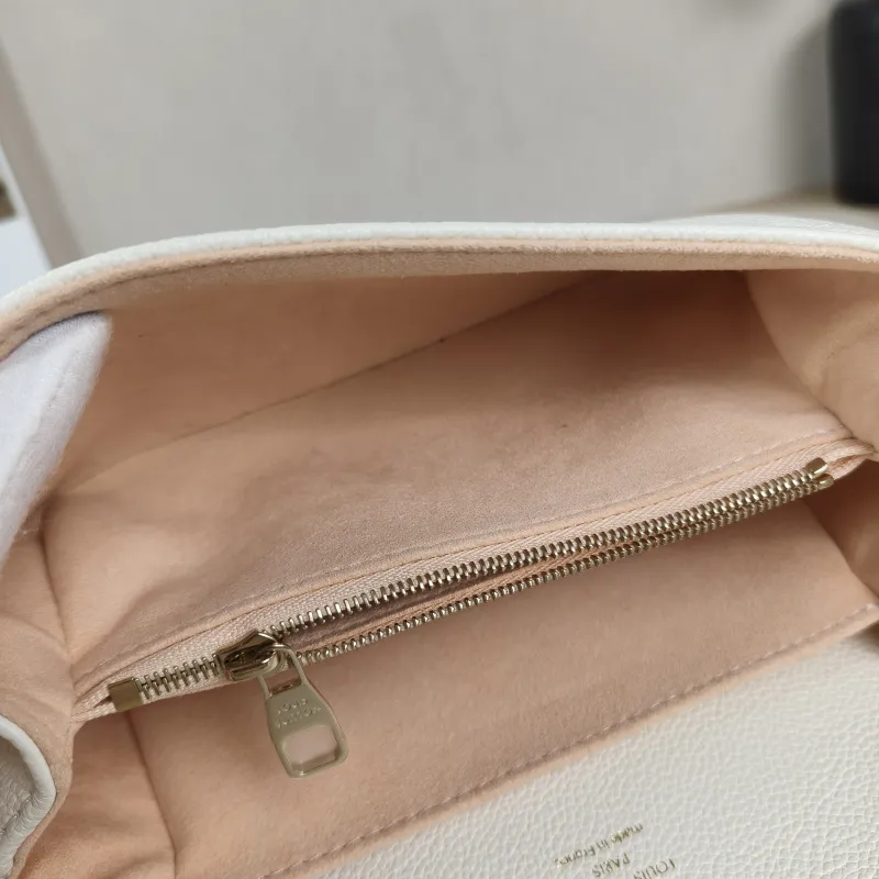 Louis Vuitton Crossbody Bag Pochette Métis East West White · Pink Monogram Empreinte Embossed Calfskin Small21.5 × 6 × 13.5 cm — detail view 7 of 13