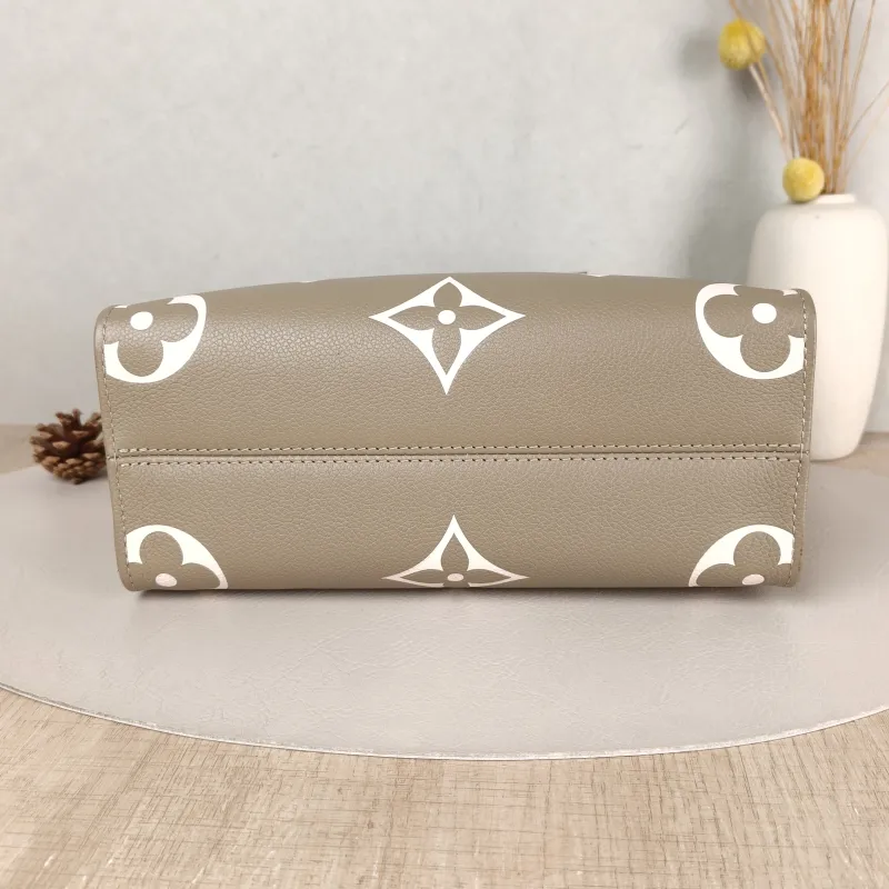 Louis Vuitton Top Handle Bag Onthego Monogram Empreinte Embossed Calfskin Small 25 × 11.5 × 19 cm — cover view 5 of 5