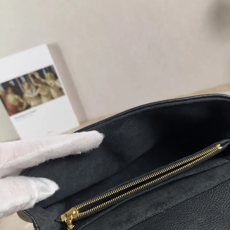 Louis Vuitton Crossbody Bag MADELEINE Black Empreinte Embossed Calfskin BB 24 × 8.5 × 17 cm — detail view 1 of 15