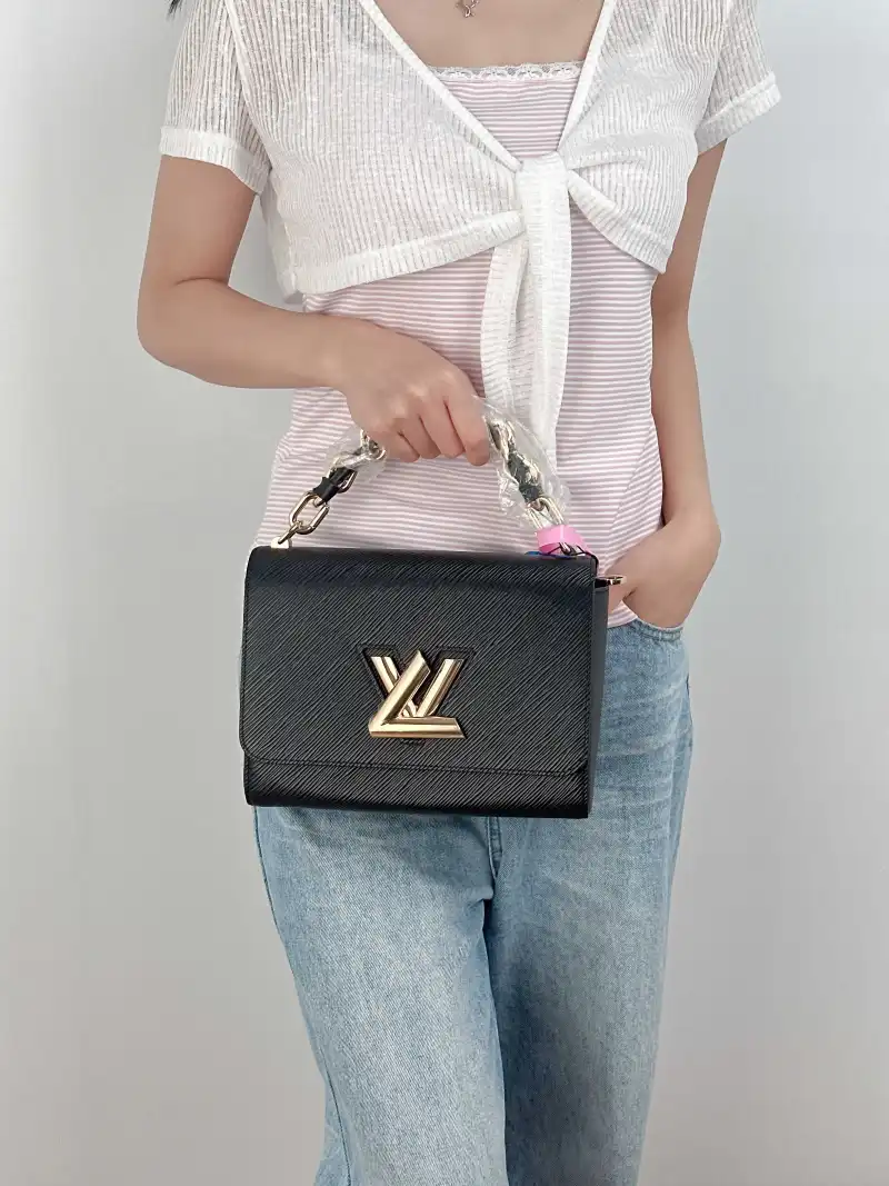 Louis Vuitton Crossbody Bag Twist Black Epi Embossed Calfskin Medium 23 × 9.5 × 17 cm — on-model view 2 of 3