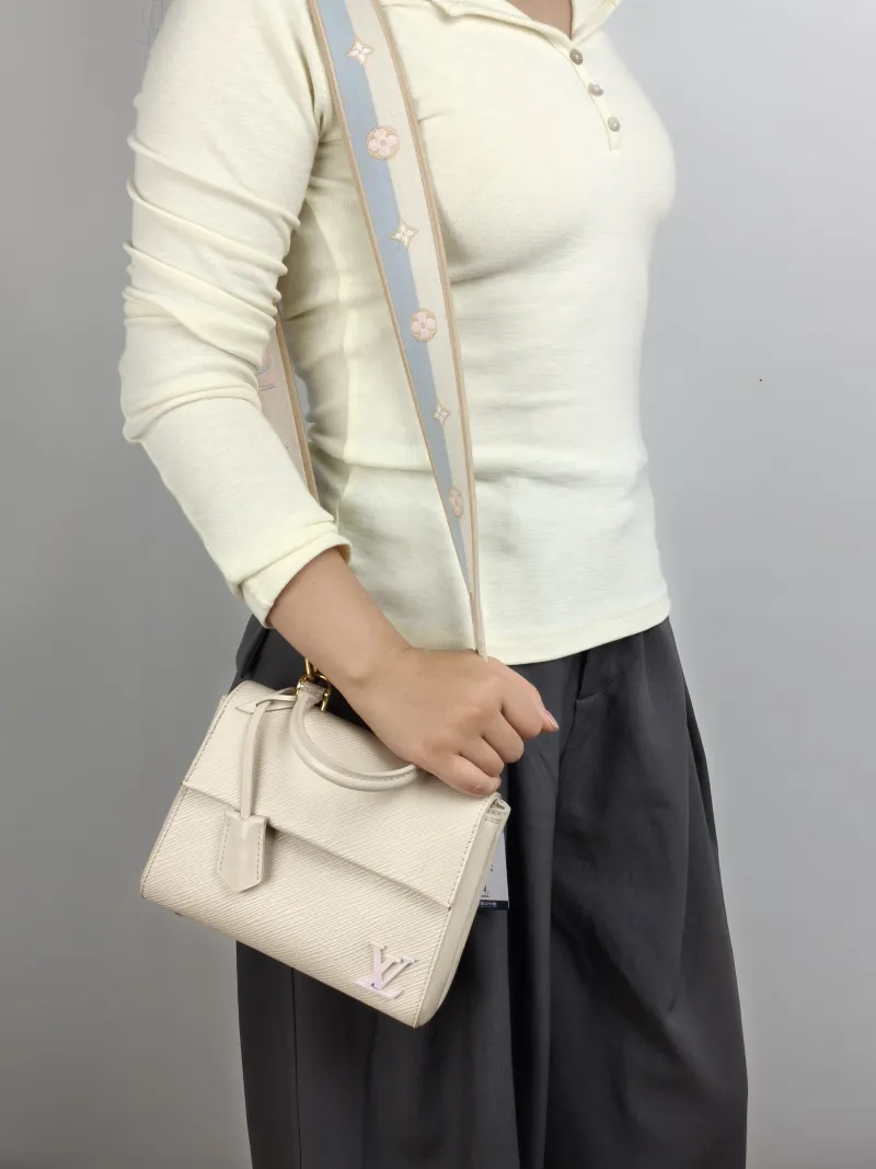 Louis Vuitton Crossbody Bag CLUNY White Epi Embossed Calfskin Mini 20 × 7.5 × 16 cm — on-model view 1 of 3