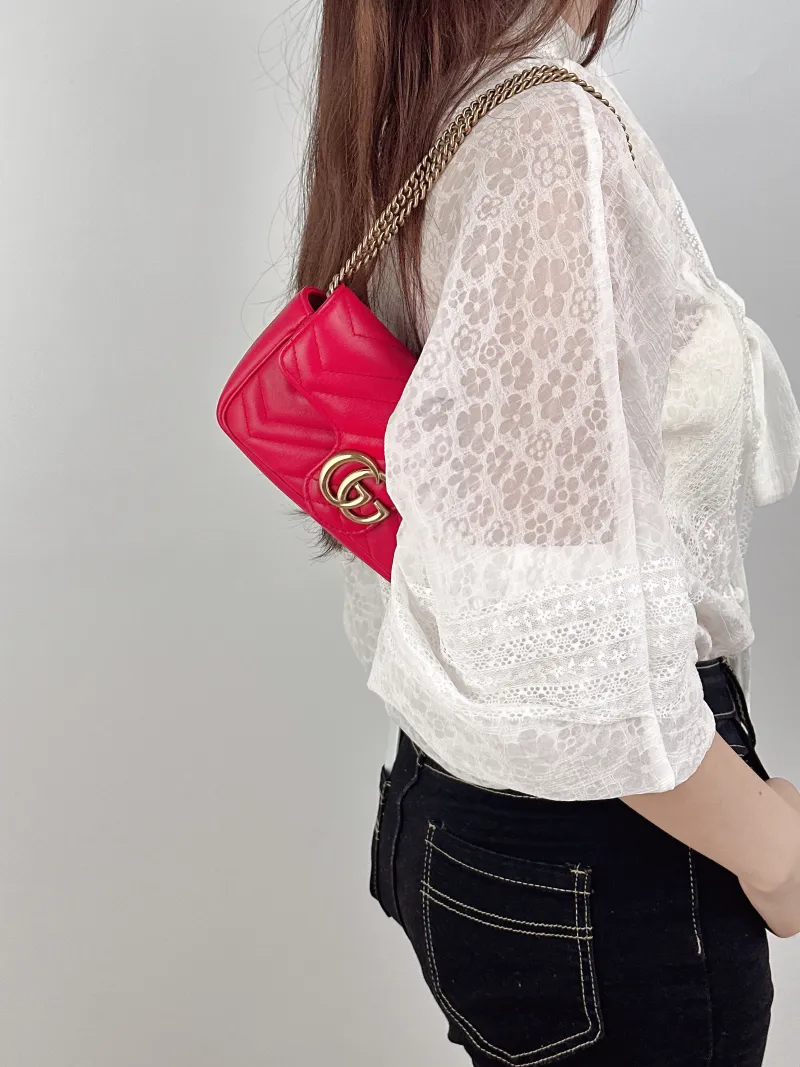 GUCCI Crossbody Bag GG Marmont Mini Marmont Mini Red Calfskinmini16.5 × 4.5 × 9.5 cm — on-model view 1 of 2