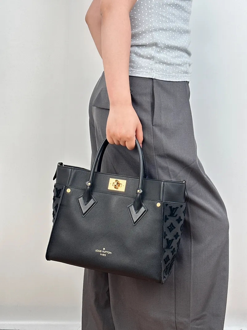 Louis Vuitton Top Handle Bag On My Side Black Calfskin Medium30.5 × 14 × 24.5 cm — on-model view 3 of 3