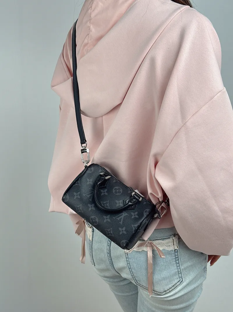 Louis Vuitton Crossbody Bag Speedy Nano Monogram PVC nano 16 × 7.5 × 10 cm — on-model view 1 of 2