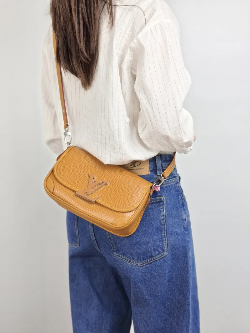 Louis Vuitton Shoulder Bag BUCI Epi Embossed Calfskin One Size 24.5 × 9 × 15.5 cm — on-model view 1 of 2