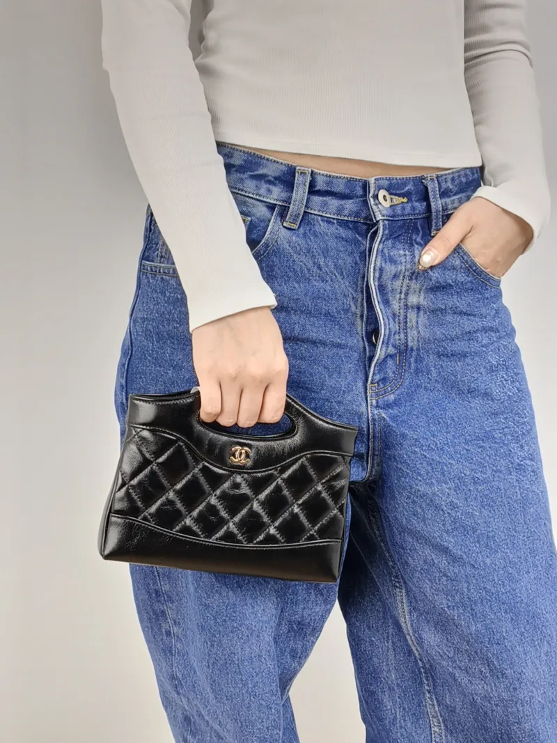 Chanel Shoulder Bag 31Bag Black Waxed Leather Calfskin nano 20.5 × 3.5 × 17 cm — on-model view 3 of 3