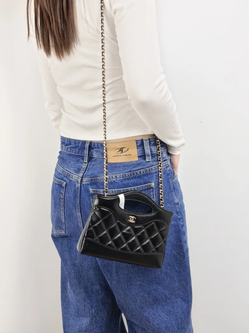 Chanel Shoulder Bag 31Bag Black Waxed Leather Calfskin nano 20.5 × 3.5 × 17 cm — on-model view 2 of 3