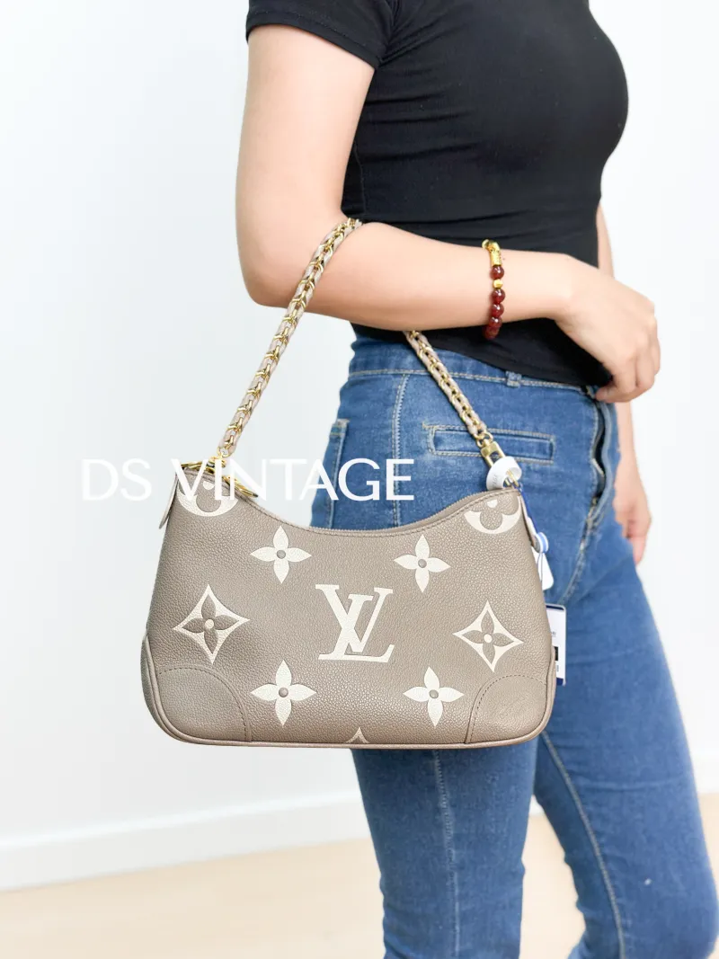 Louis Vuitton Crossbody Bag Boulogne Monogram Empreinte Embossed Calfskin Small 26 × 9.5 × 16 cm — on-model view 2 of 3
