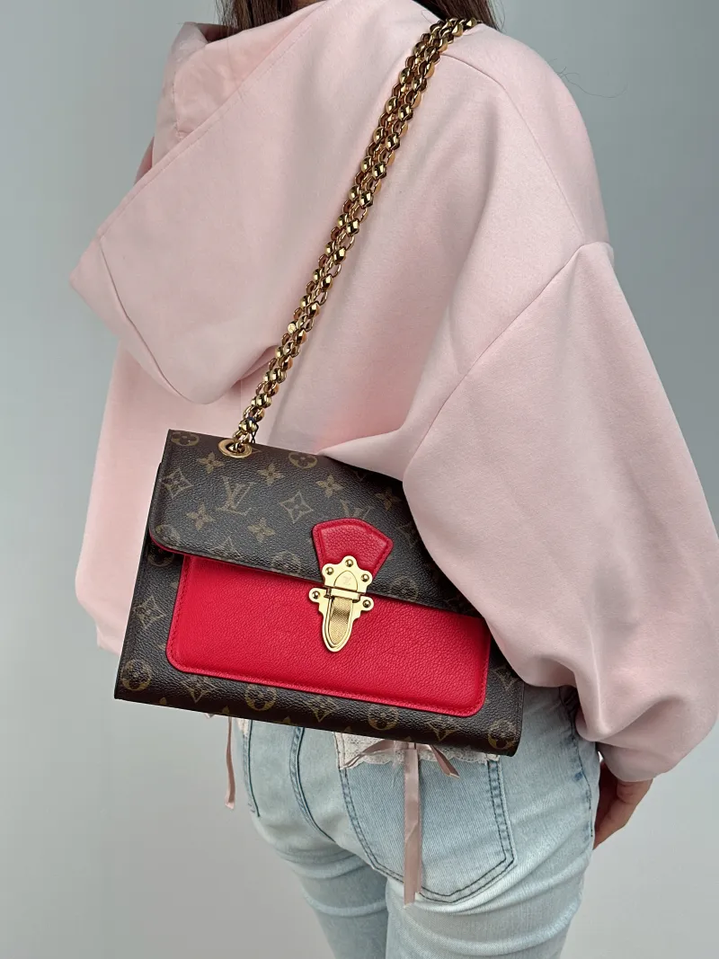 Louis Vuitton Crossbody Bag VICTOIRE Red PVC · Calfskin One Size 27 × 10 × 17 cm — on-model view 2 of 2