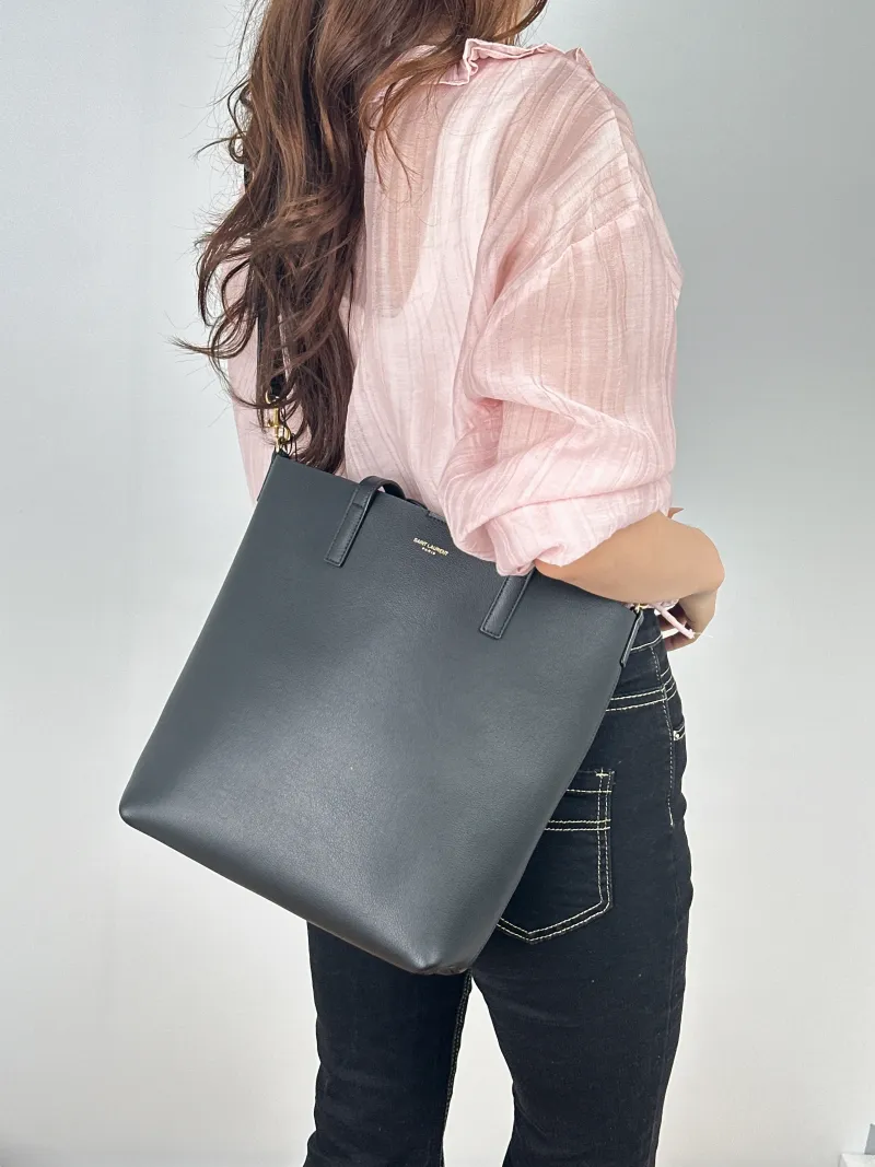 SAINT LAURENT Top Handle Bag SHOPPING Shopping Tote Edition Black Calfskinmini25 × 8 × 28 cm — on-model view 1 of 2