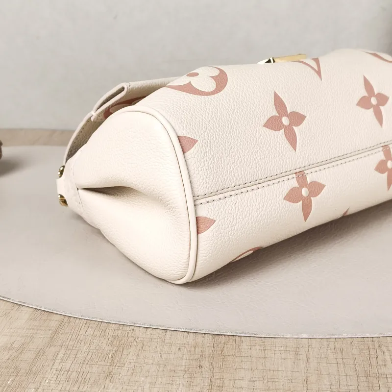 Louis Vuitton Crossbody Bag Favorite White · Pink Empreinte Embossed Calfskin Monogram Medium24 × 9 × 14 cm — detail view 10 of 12