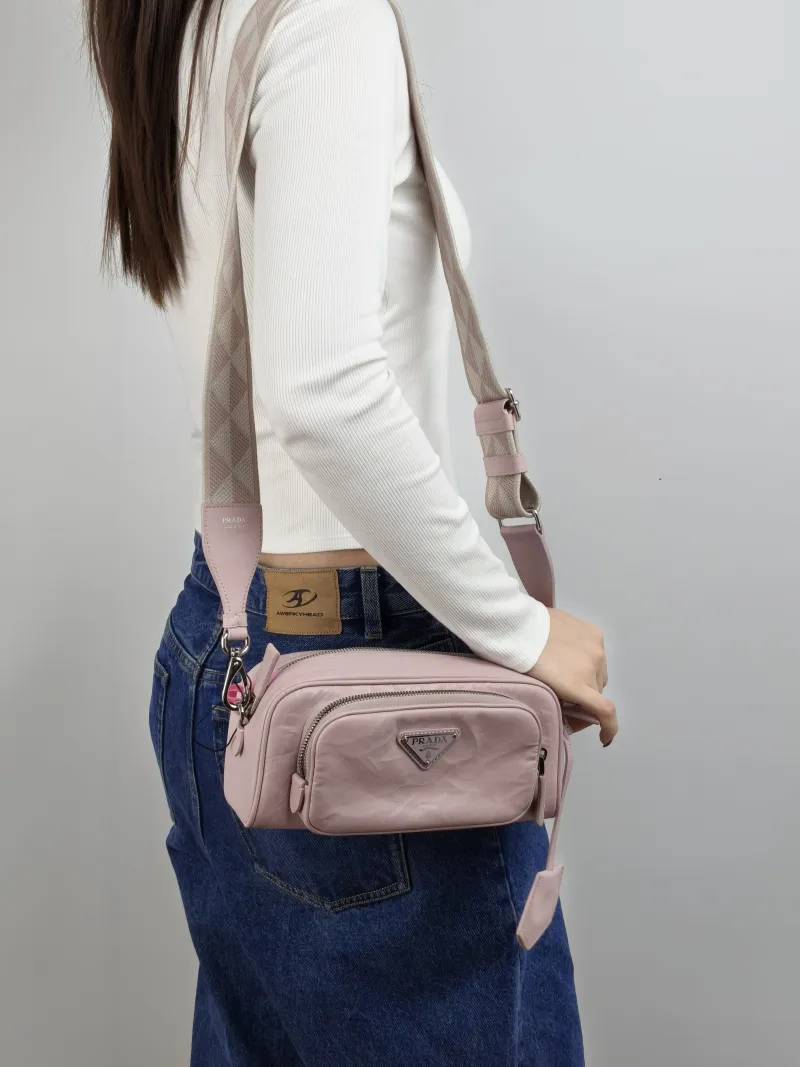 PRADA Crossbody Bag Camera Bag Pink Lambskin One Size 23 × 7 × 10 cm — on-model view 1 of 2