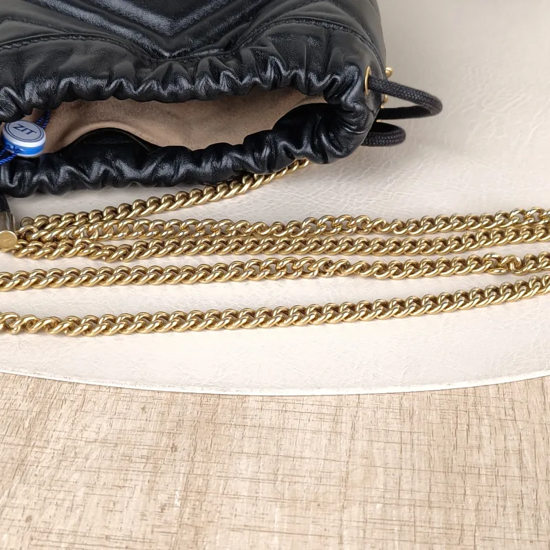 GUCCI Crossbody Bag GG Marmont Marmont Bucket Bag Black with Gold-Tone Hardware Calfskinmini13 × 10 × 17.5 cm — detail view 5 of 11