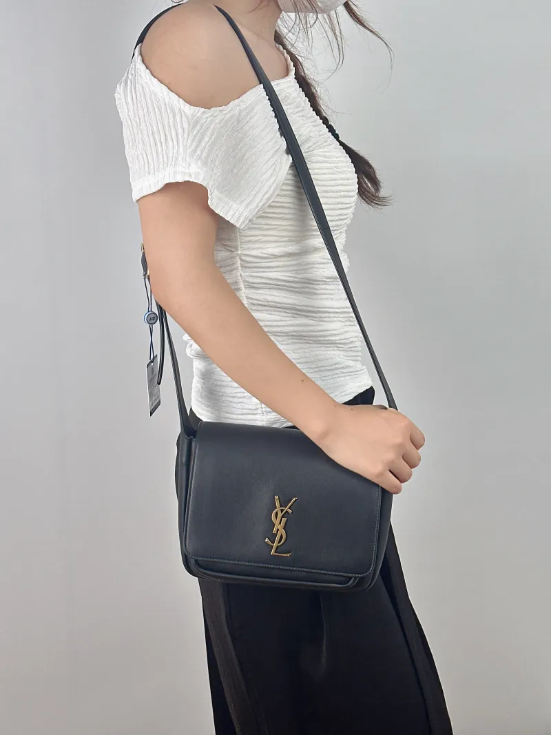 SAINT LAURENT Crossbody Bag Niki Besace Messenger Bag Black Calfskin Small 21.5 × 9.5 × 16 cm — on-model view 1 of 2