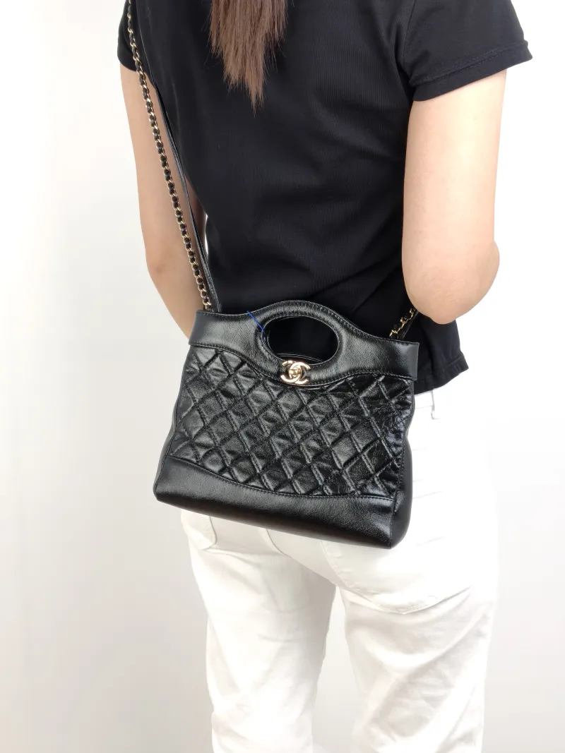 Chanel Crossbody Bag31Bag Black Waxed Leathermini23 × 5.5 × 22 cm — on-model view 3 of 3