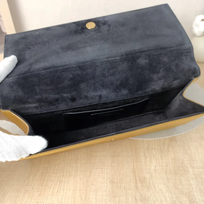 SAINT LAURENT Clutch Clutch Gold Calfskin 27 × 4 × 13 cm — detail view 2 of 12