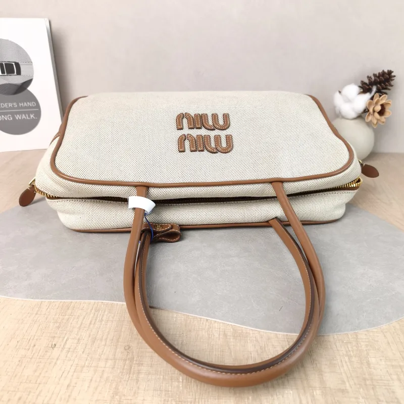 Miumiu Top Handle Bag Beau Brown Canvas · Calfskin Large 34 × 10 × 20 cm — detail view 1 of 12
