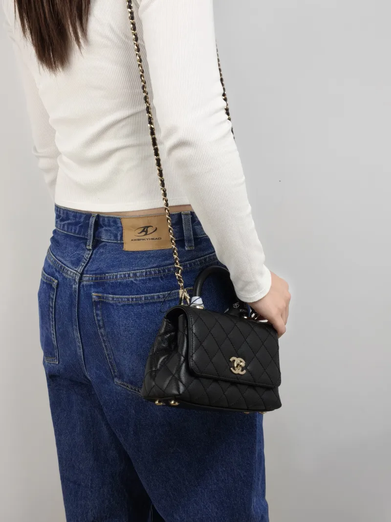 Chanel Top Handle Bag Coco Handle​ Black Grained Calfskin Mini 19 × 9 × 13 cm — on-model view 3 of 3