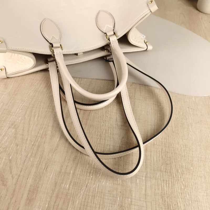 Louis Vuitton Shoulder Bag Onthego Medium White Monogram Empreinte Embossed Calfskin Medium 35 × 14 × 27 cm — detail view 8 of 10