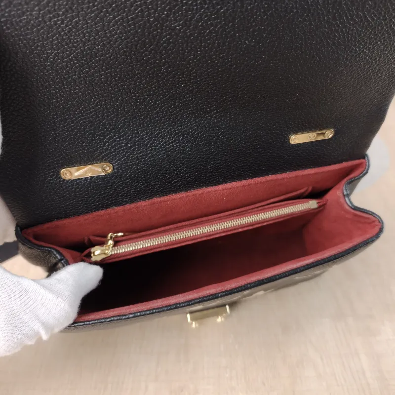 Louis Vuitton Crossbody Bag MADELEINE Black · White Monogram Empreinte Embossed Calfskin BB 24 × 8.5 × 17 cm — detail view 8 of 13