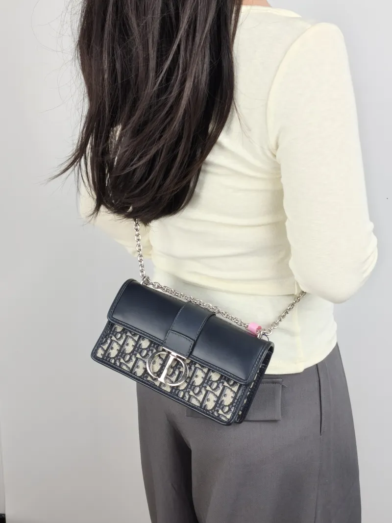 DIOR Crossbody Bag 30 Montaigne East-West 30 Blue Canvas， Small 21 × 6 × 12 cm — on-model view 2 of 3