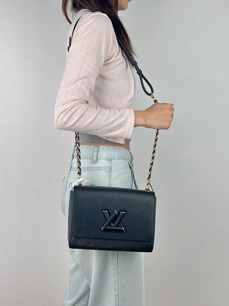 Louis Vuitton Crossbody Bag Twist Black Epi Embossed Calfskin Medium 23 × 9.5 × 17 cm — on-model view 1 of 2