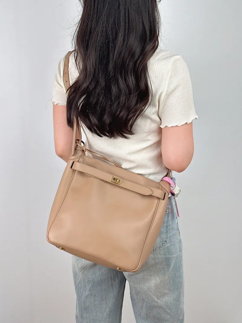 BALENCIAGA Crossbody Bag bel Crossbody Bag Taupe Calfskin One Size 27 × 9 × 28 cm — on-model view 2 of 2