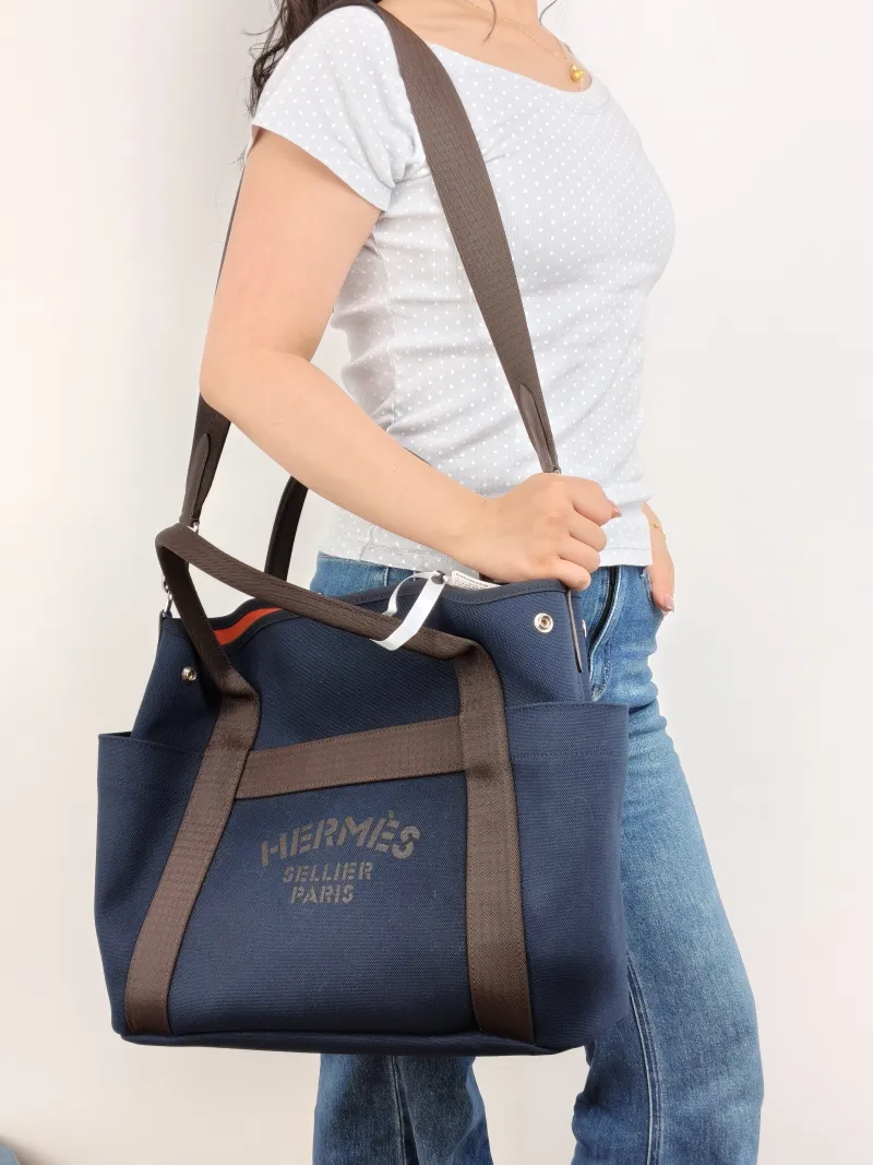 Hermès Top Handle Bag Top Handle Bag Canvas One Size 39 × 15 × 35 cm B — on-model view 1 of 2