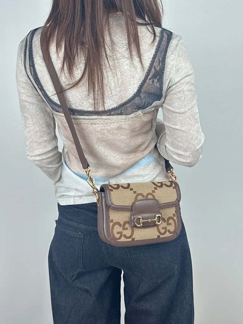 GUCCI Crossbody Bag Horsebit 1955 Horsebit Small Canvas 20.5 × 5 × 14.5 cm — on-model view 1 of 2