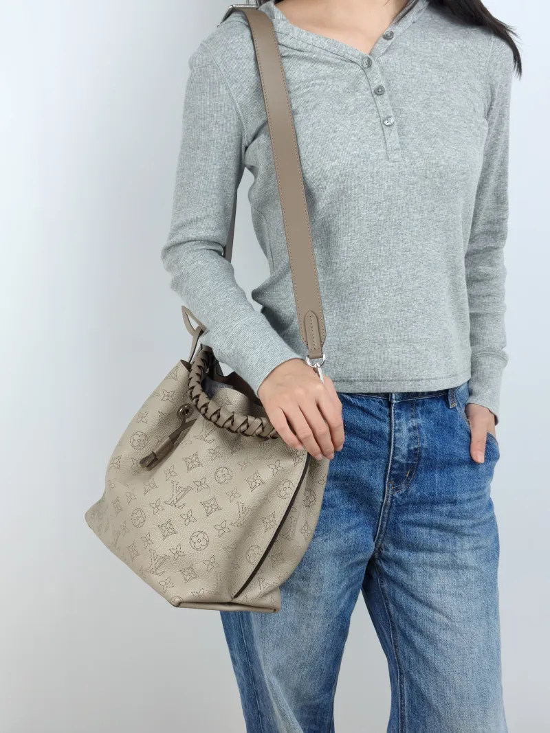 Louis Vuitton Shoulder Bag Muria Grey Calfskin One Size 26 × 14 × 26 cm — on-model view 1 of 3