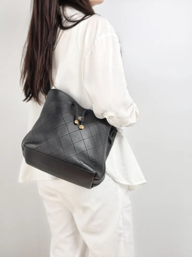 Chanel Shoulder Bag Bucket Bag Black Lambskin 22.5 × 13 × 22 cm — on-model view 2 of 2