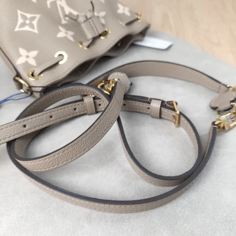 Louis Vuitton Crossbody Bag NANO NOÉ Bucket Bag Nano · White Empreinte Embossed Calfskin Monogramnano13 × 10 × 16 cm — detail view 1 of 15