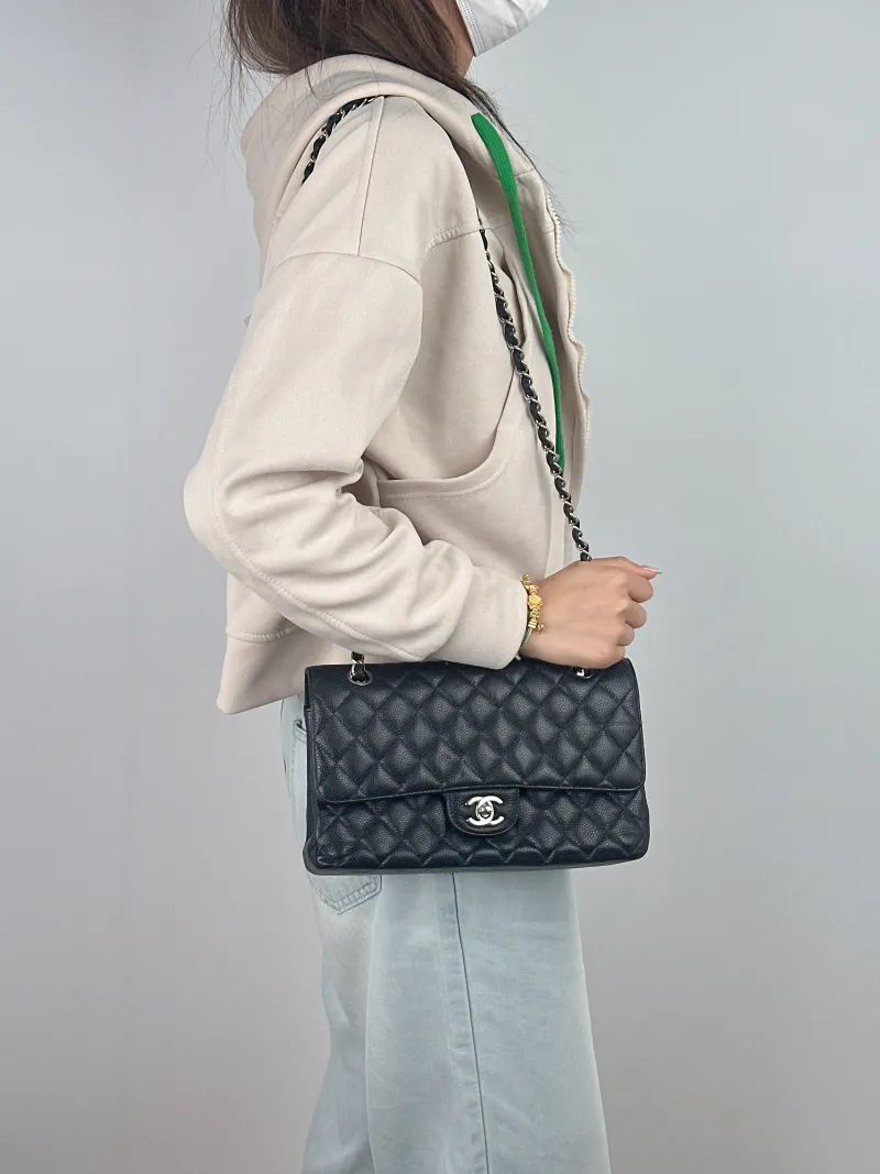 Chanel Crossbody Bag Classic Flap CF Black Grained Calfskin Medium 25.5 × 6.5 × 15.5 cm 23 — on-model view 1 of 2
