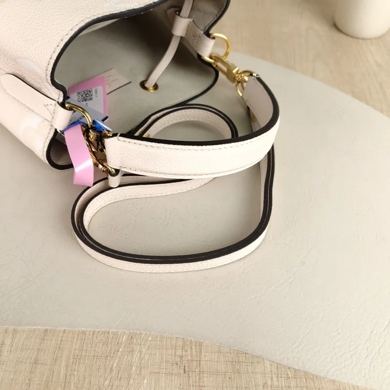 Louis Vuitton Crossbody Bag NÉONOÉ Bucket Bag BB Monogram Empreinte Embossed Calfskin BB 20 × 13 × 20 cm Conditioned — detail view 8 of 11