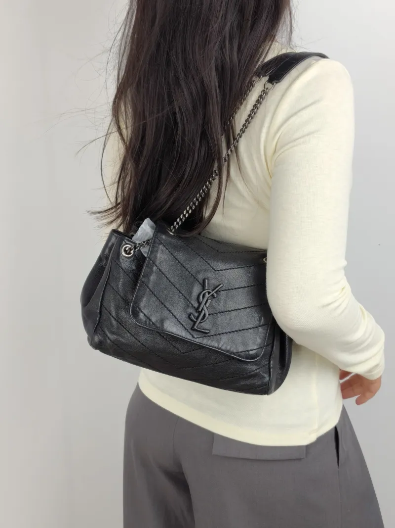 SAINT LAURENT Crossbody Bag NOLITA Black Lambskin Small 22 × 13 × 17.5 cm — on-model view 1 of 2