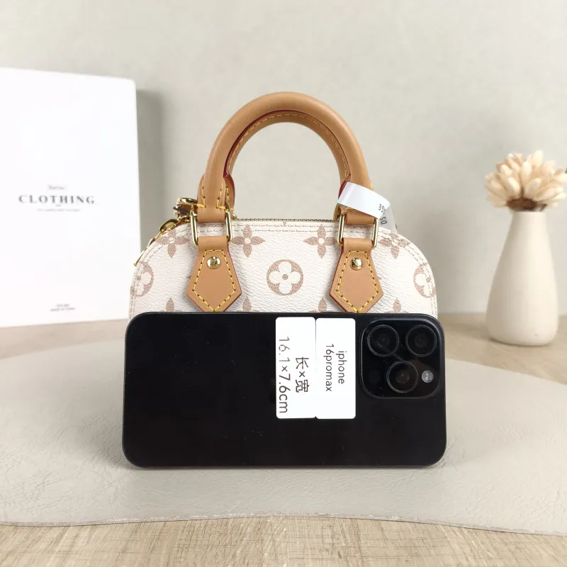Louis Vuitton Crossbody Bag Alma Nano · Black PVC nano 18 × 8 × 12 cm — cover view 3 of 5