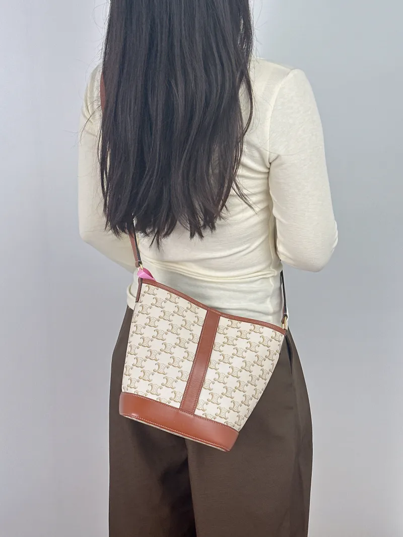 CELINE Crossbody Bag Triomphe Bucket Bag White PVC Small 22 × 13 × 26 cm — on-model view 1 of 2