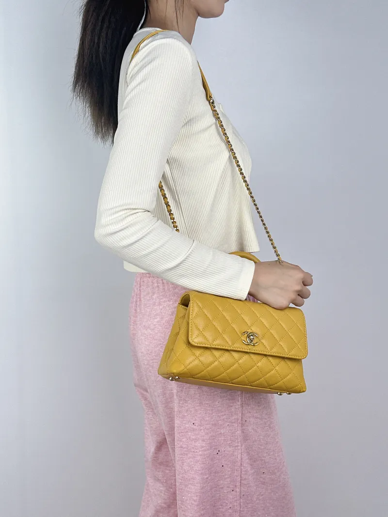 Chanel Crossbody Bag Coco Handle​ Yellow Calfskin Small24 × 10 × 14 cm — on-model view 1 of 2